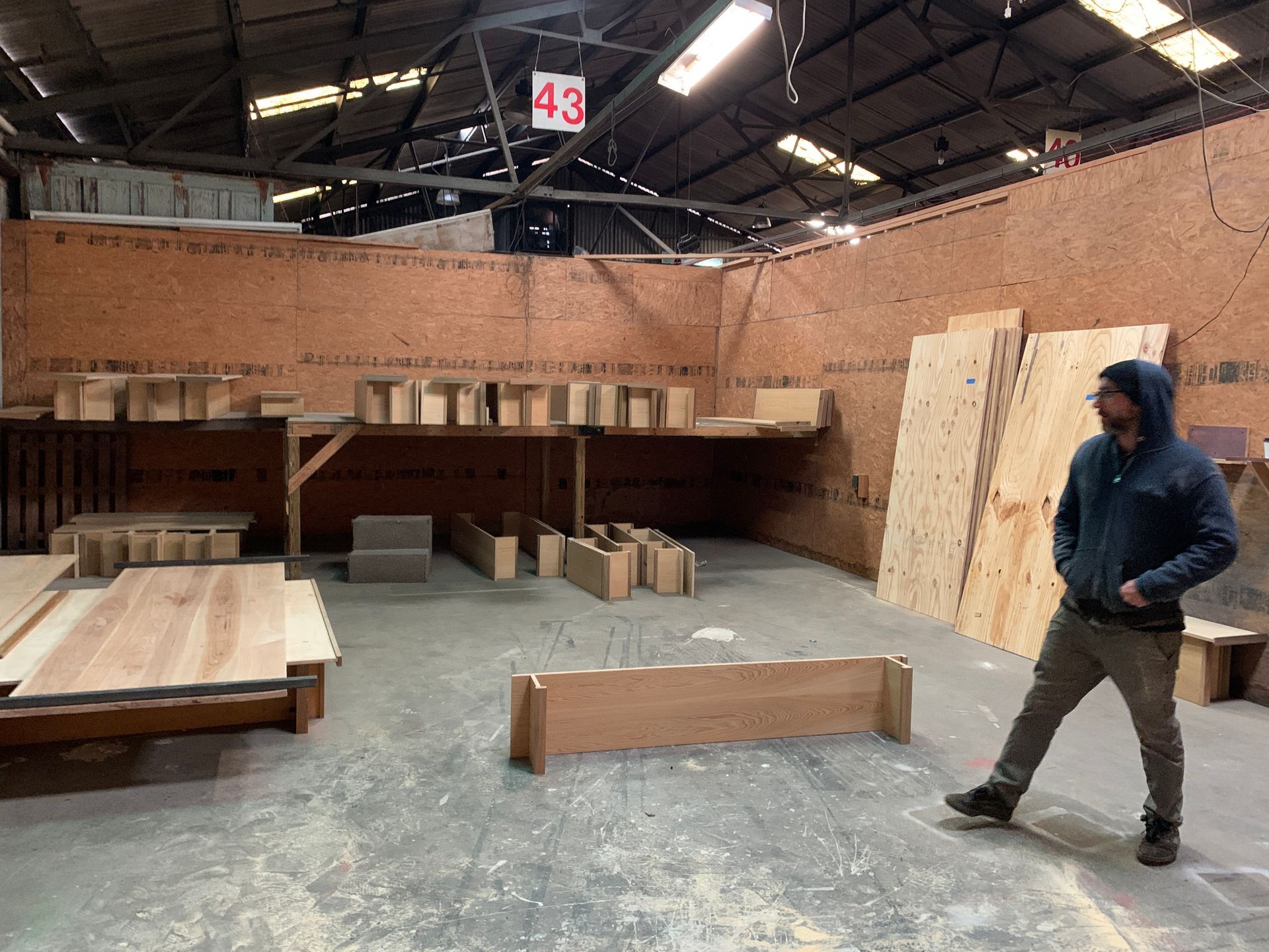 Chris Owens in his workshop with parts for the custom Syd beds